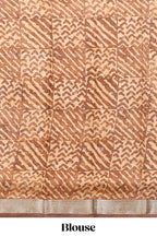 Orange geomatric tussar saree contrasting brown border with geomatric patterns ,and matching pallu with zari stripes blouse