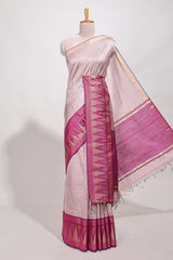 Peach semi tussar sareeall-over fine checked zari with border geometric zig-zag metallic weaving and contrast blouse