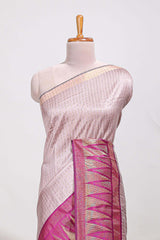 Peach semi tussar sareeall-over fine checked zari with border geometric zig-zag metallic weaving and contrast blouse