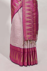 Peach semi tussar sareeall-over fine checked zari with border geometric zig-zag metallic weaving and contrast blouse