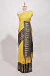 Yellow semi tussar sareeall-over fine checked zari with border geometric zig-zag metallic weaving and contrast blouse