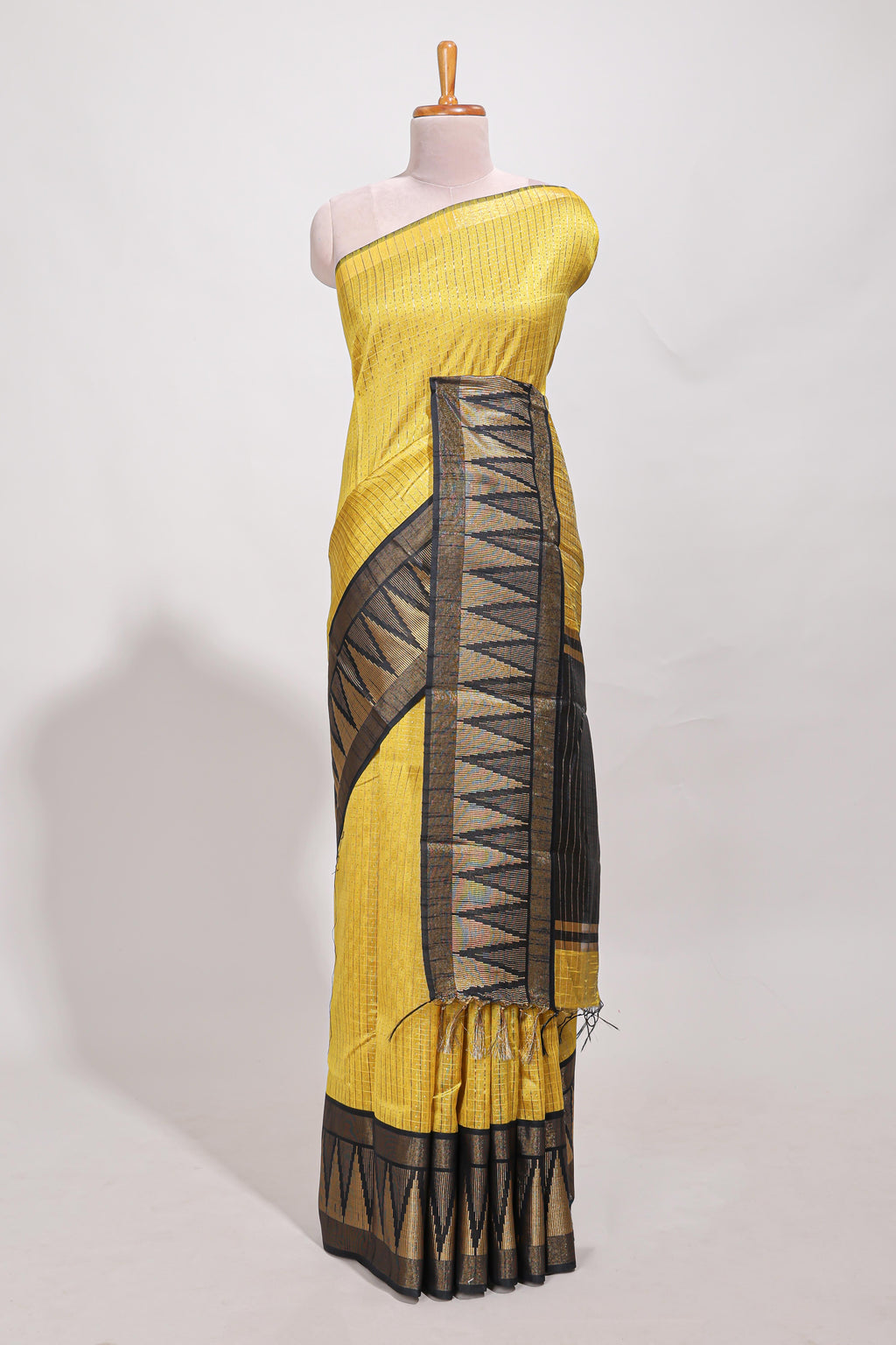Yellow semi tussar saree  all-over fine checked zari with border geometric zig-zag metallic weaving and contrast blouse
