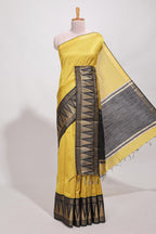 Yellow semi tussar saree  all-over fine checked zari with border geometric zig-zag metallic weaving and contrast blouse