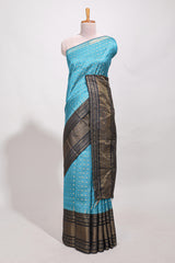 Blue silk body golden zari butta pattern and Broad golden zari border with contrast blouse