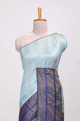 Powder blue silk body golden zari striped pattern and Broad golden zari border with contrast blouse