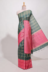 Dark green silk body golden zari butta striped pattern and Broad golden zari border with contrast blouse