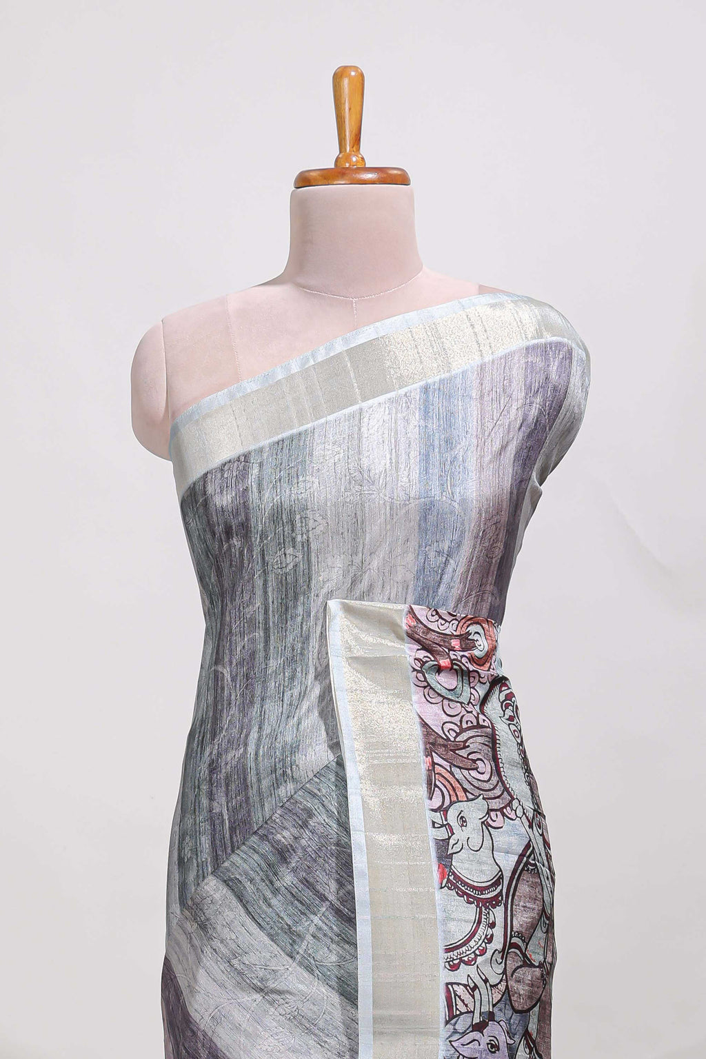 Multi colour kalamakri tussar saree  with floral creeper prints zari border and kalamkari peacock motif print pallu