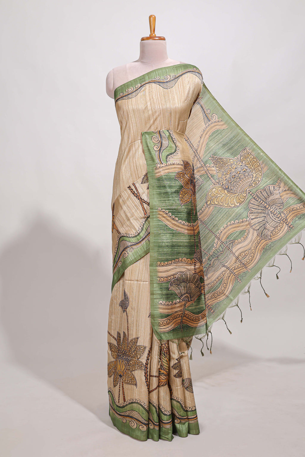 Beige colour semi tussar saree with contrast leaf  border and nature art pallu with contrast blouse