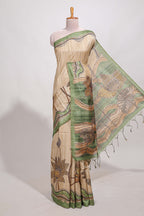 Beige colour semi tussar saree with contrast leaf  border and nature art pallu with contrast blouse