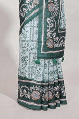 Green colour floral printedsemi tussar saree with creeperborder and matching printed blouse