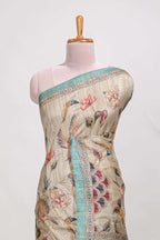 Cream colour semi tussar saree all over floral print with small contrast border and floral printed pallu with contrast blouse