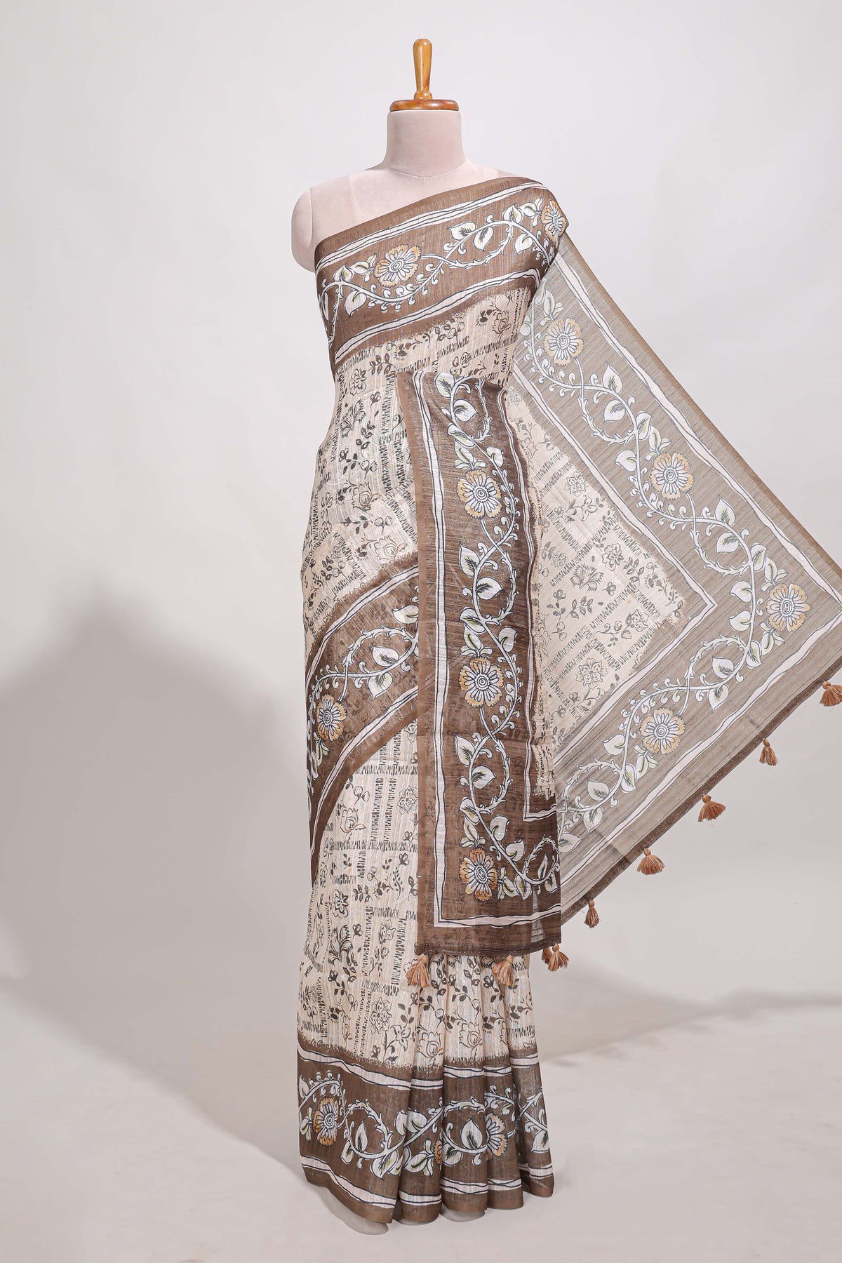 Brown colour floral printed  semi tussar saree with creeper  border and matching printed blouse