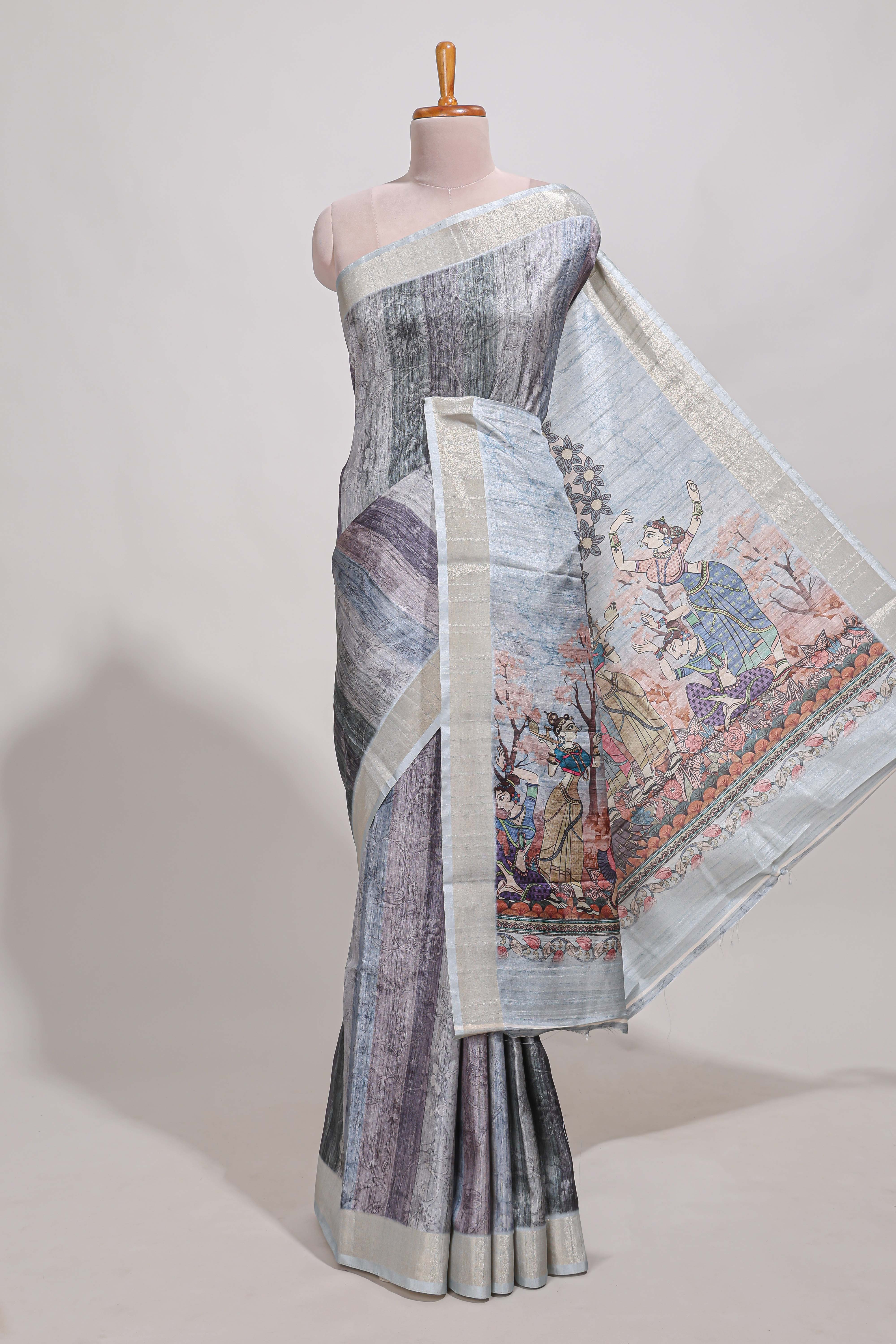 Grey kalamakri arttussar sareewith floral creeper prints zari border and dancing figures print pallu