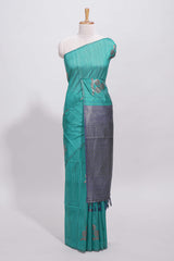 Borderless peacock green round butta art tussar saree with contrast pallu and blouse