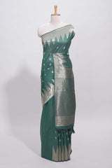 Green ikkat style silver zari butta art tussar saree with self zari temple design border and matching blouse