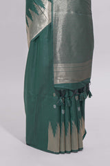Green ikkat style silver zari butta art tussar saree with self zari temple design border and matching blouse