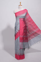 Grey plain art tussar saree with contrast border and striped pallu