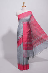 Grey plain art tussar saree with contrast border and striped pallu