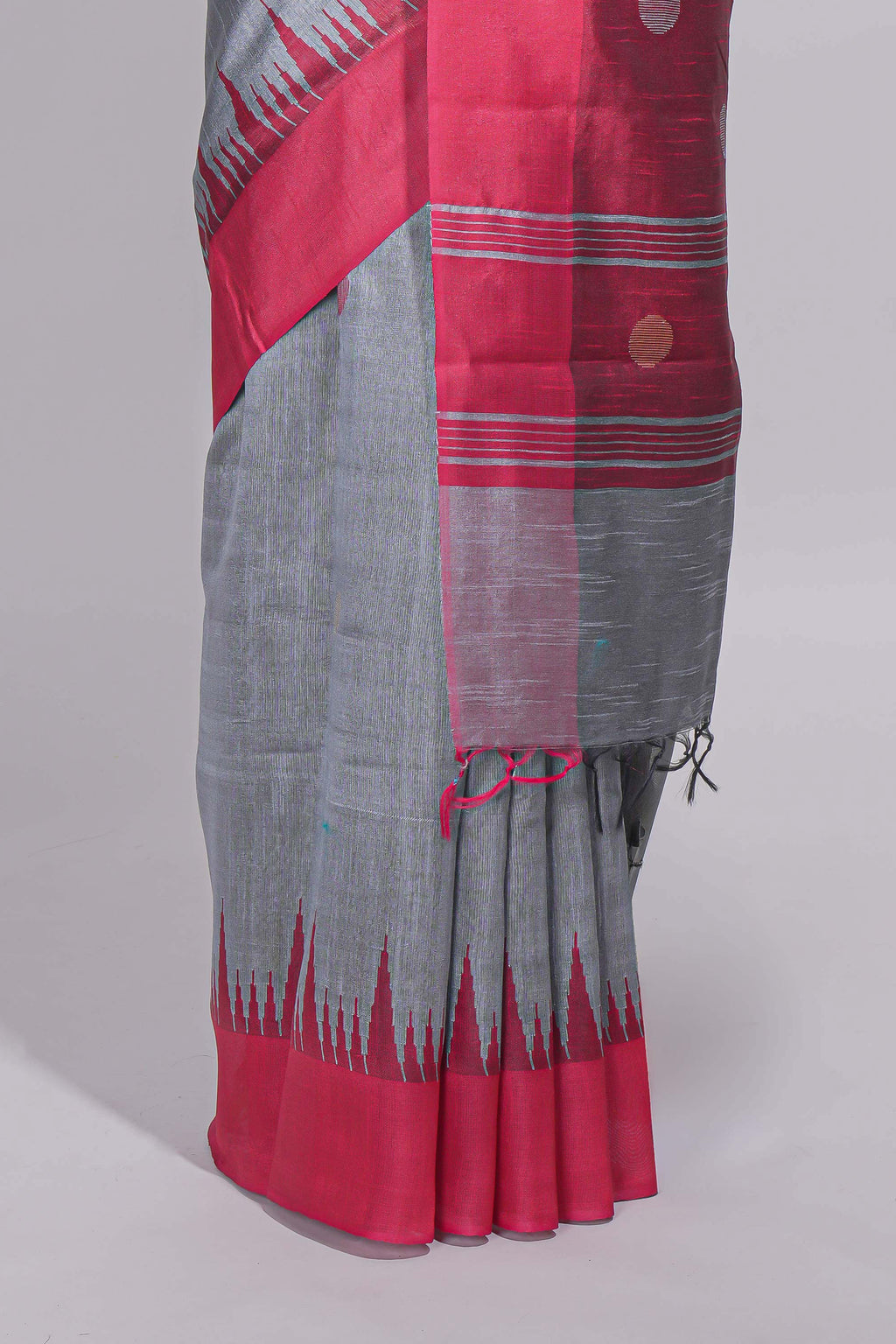 Grey plain art tussar saree with contrast border and striped pallu
