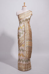Beige and ivory tussar saree body chevron prints floral motifs and printed pallu along with matching blouse
