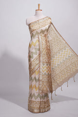 Beige and ivory tussar saree body chevron prints floral motifs and printed pallu along with matching blouse