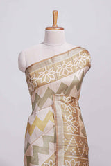 Beige and ivory tussar saree body chevron prints floral motifs and printed pallu along with matching blouse