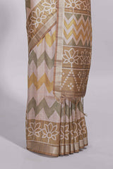 Beige and ivory tussar saree body chevron prints floral motifs and printed pallu along with matching blouse