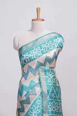 Teal blue tussar saree body chevron prints floral motifs and printed pallu along with matching blouse