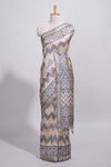 Grey and ivory color tussar saree body chevron prints floral motifs and printed pallu along with matching blouse