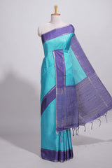 Aqua blue tussar saree with woven checks by rich purple border and matching zari woven palluwith matching blouse piece