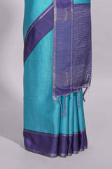 Aqua blue tussar saree with woven checks by rich purple border and matching zari woven palluwith matching blouse piece