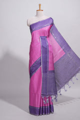 Pink tussar saree with woven checks by rich purple border and matching zari woven pallu with matching blouse piece