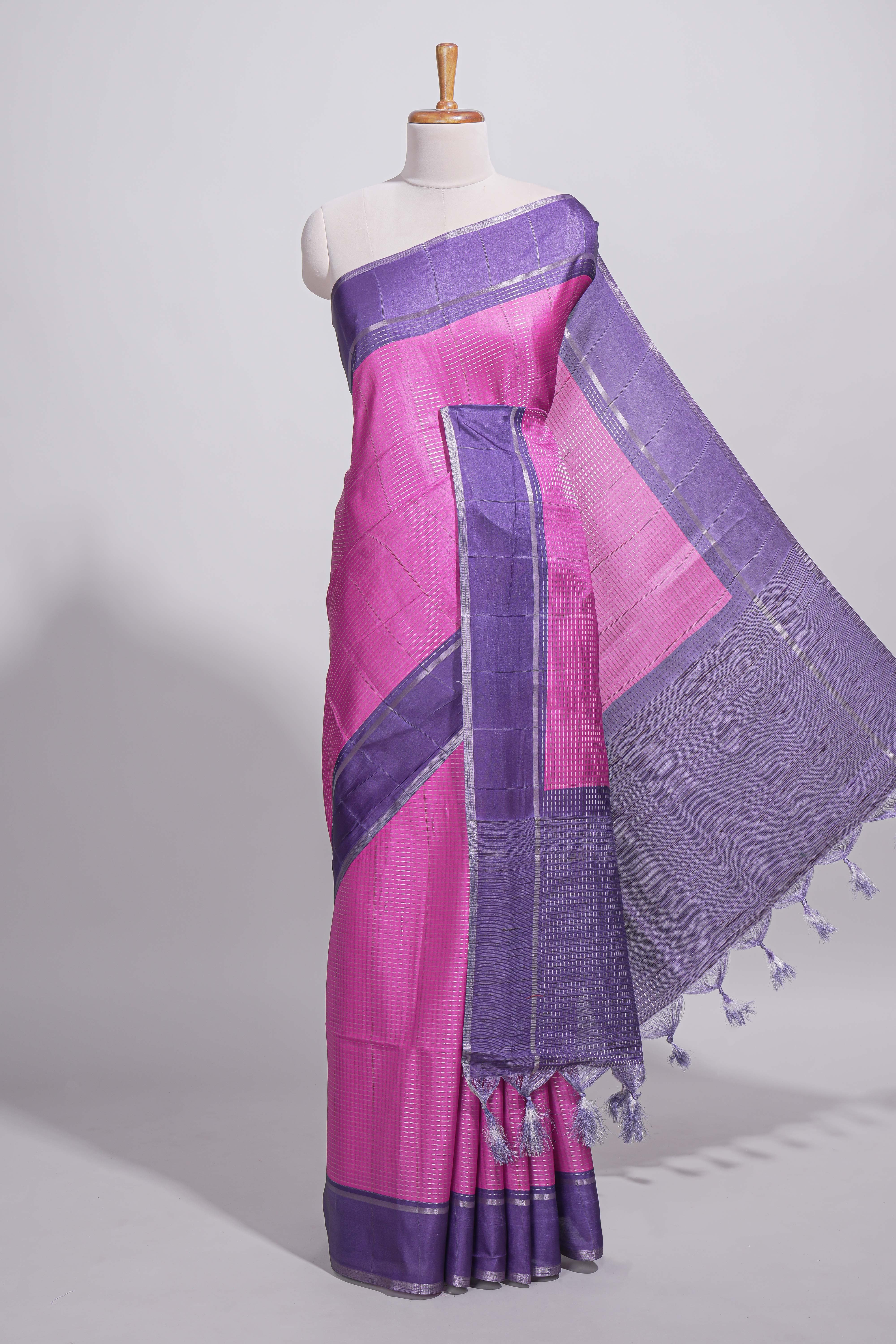 Pink tussar saree with woven checks by rich purple border and matching zari woven pallu with matching blouse piece