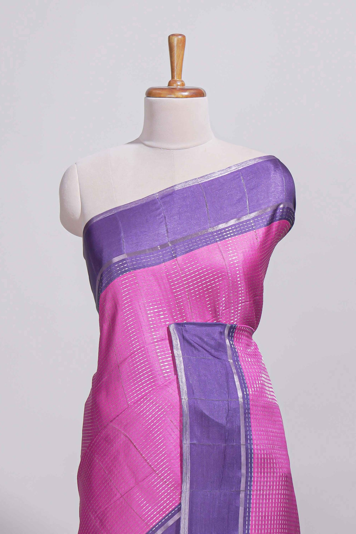Pink tussar saree with woven checks by rich purple border and matching zari woven pallu with matching blouse piece