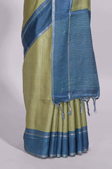 Green tussar saree with woven checks by rich blue border and matching zari woven pallu with contrast blouse piece