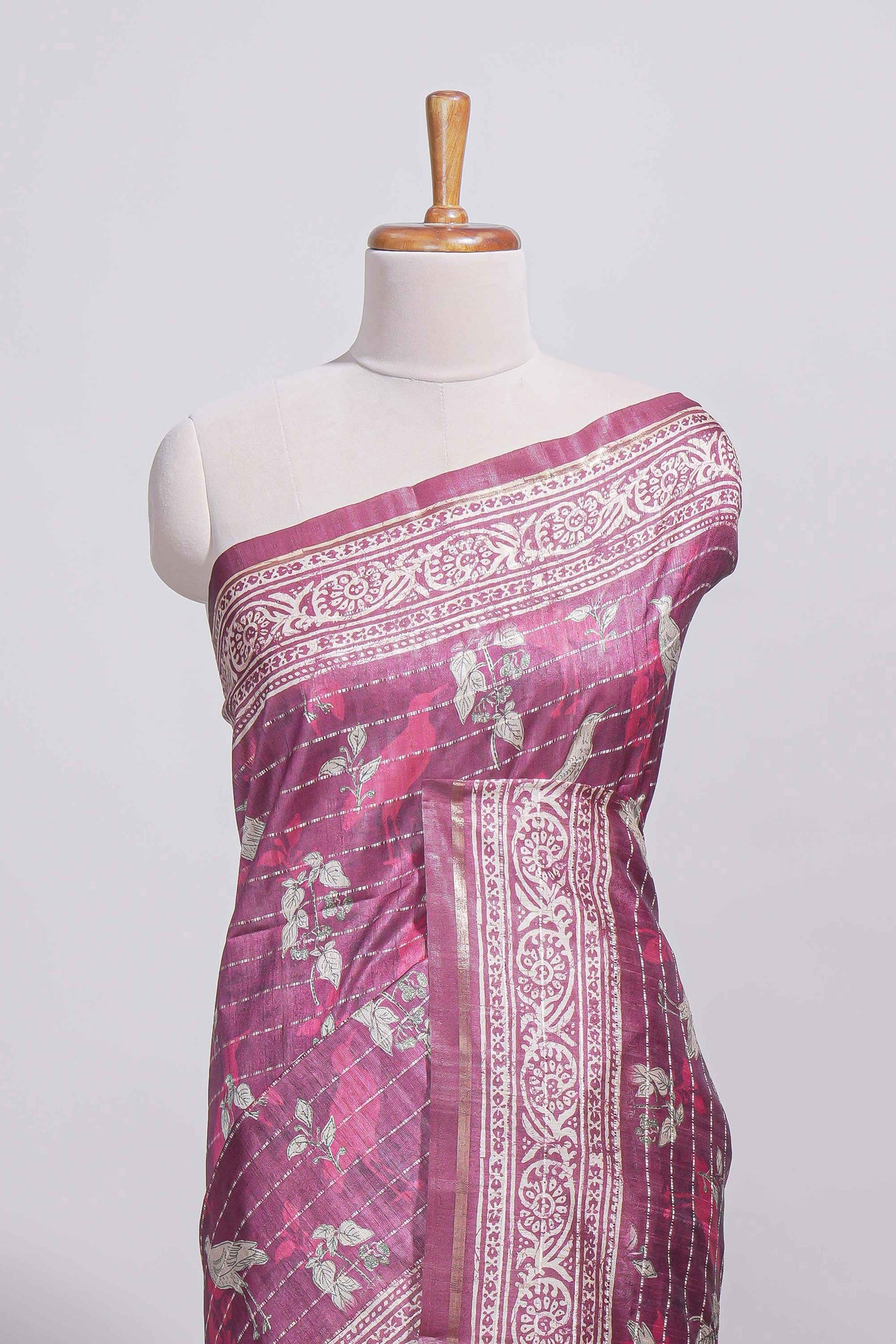 Dusty rose pink tussar saree with silver floral and bird motifs by fine metallic stripes and printed border and pallu with tassels with matching blouse piece