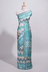 Turquoise color tussar saree body chevron prints floral motifs and printed pallu along with matching blouse