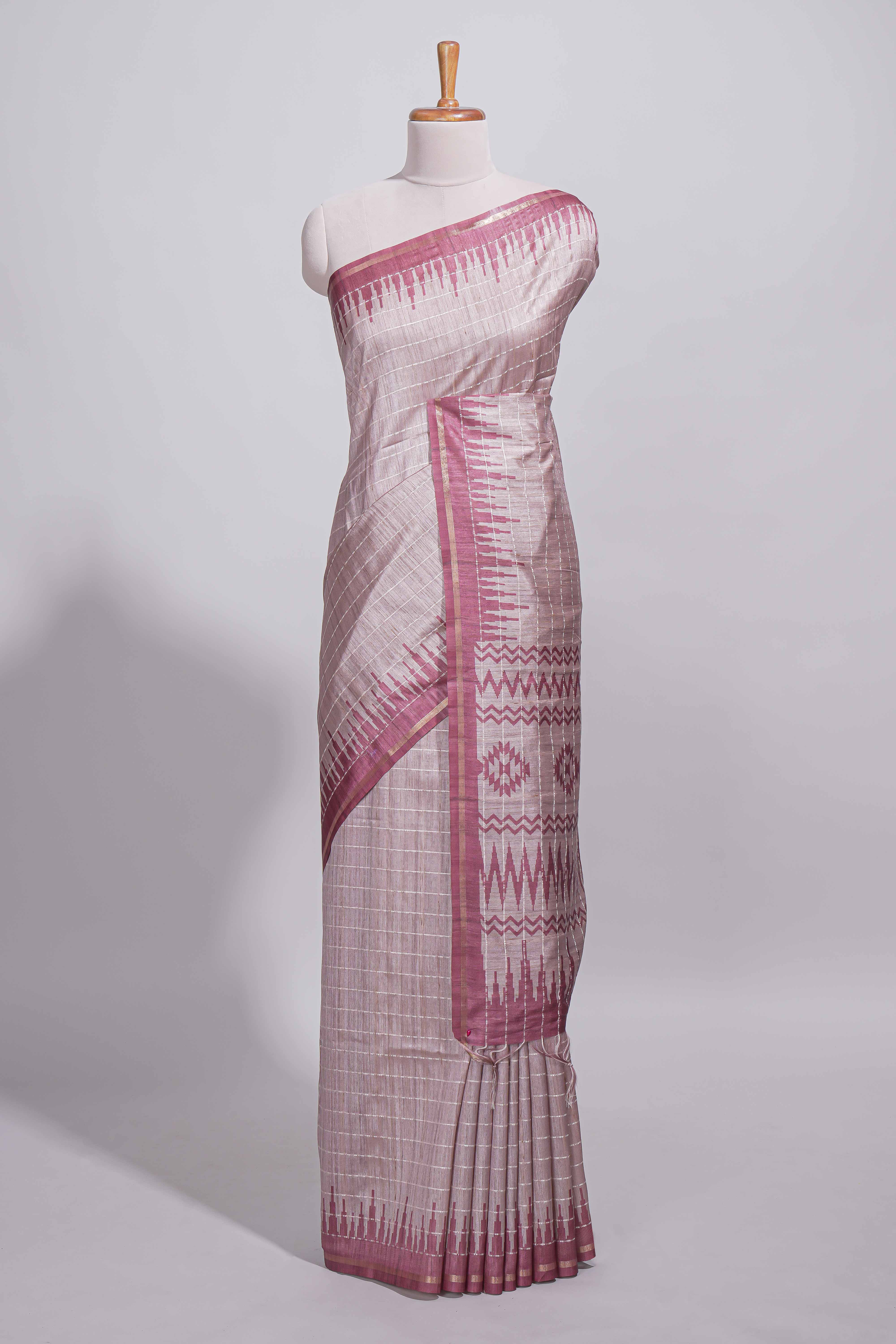 Soft blush pink tussar saree with subtle woven stripes Ikat-inspired border geometric woven pallu with tassels with blouse piece
