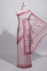 Soft blush pink tussar saree with subtle woven stripes Ikat-inspired border geometric woven pallu with tassels with blouse piece