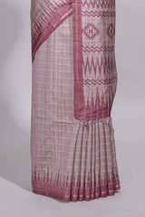 Soft blush pink tussar saree with subtle woven stripes Ikat-inspired border geometric woven pallu with tassels with blouse piece