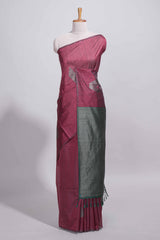 Maroon tussar saree with subtle silver woven motifs paired with a rich zari pallu with tassels with contrast blouse piece