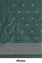 Maroon tussar saree with subtle silver woven motifs paired with a rich zari pallu with tassels with contrast blouse piece