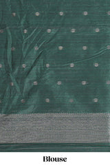 Maroon tussar saree with subtle silver woven motifs paired with a rich zari pallu with tassels with contrast blouse piece