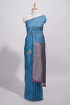 Royal blue tussar saree with subtle silver woven motifs paired with a rich zari pallu with tassels with contrast blouse piece