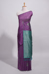 Violet tussar saree with subtle silver woven motifs paired with a rich zari pallu with tassels with contrast blouse piece