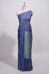 Navy blue tussar saree with subtle silver woven motifs paired with a rich zari pallu with tassels with contrast blouse piece