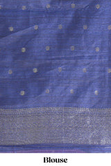 Rose color tussar saree with subtle silver woven motifs paired with a rich zari pallu with tassels with contrast blouse piece
