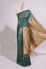 Borderless floral design green art tussar saree with contrast pallu and silver motifs blouse