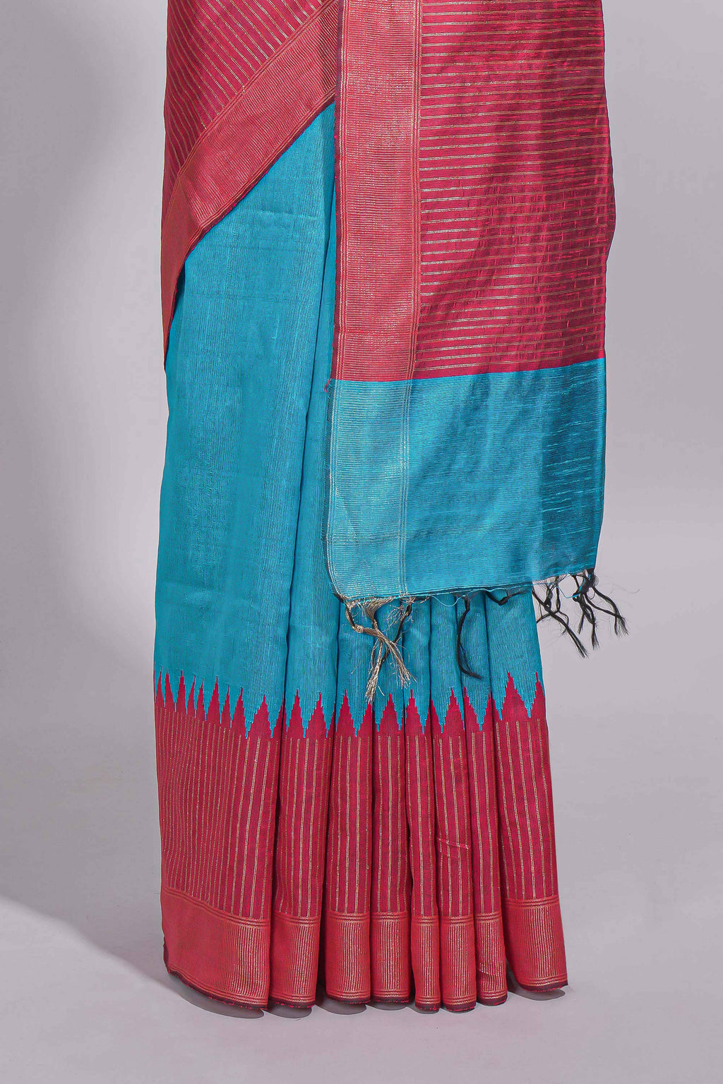 Aqua blue Tussar saree with magenta zari woven border and contrast pallu with matching magenta blouse