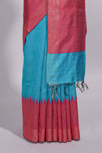 Aqua blue Tussar saree with magenta zari woven border and contrast pallu with matching magenta blouse